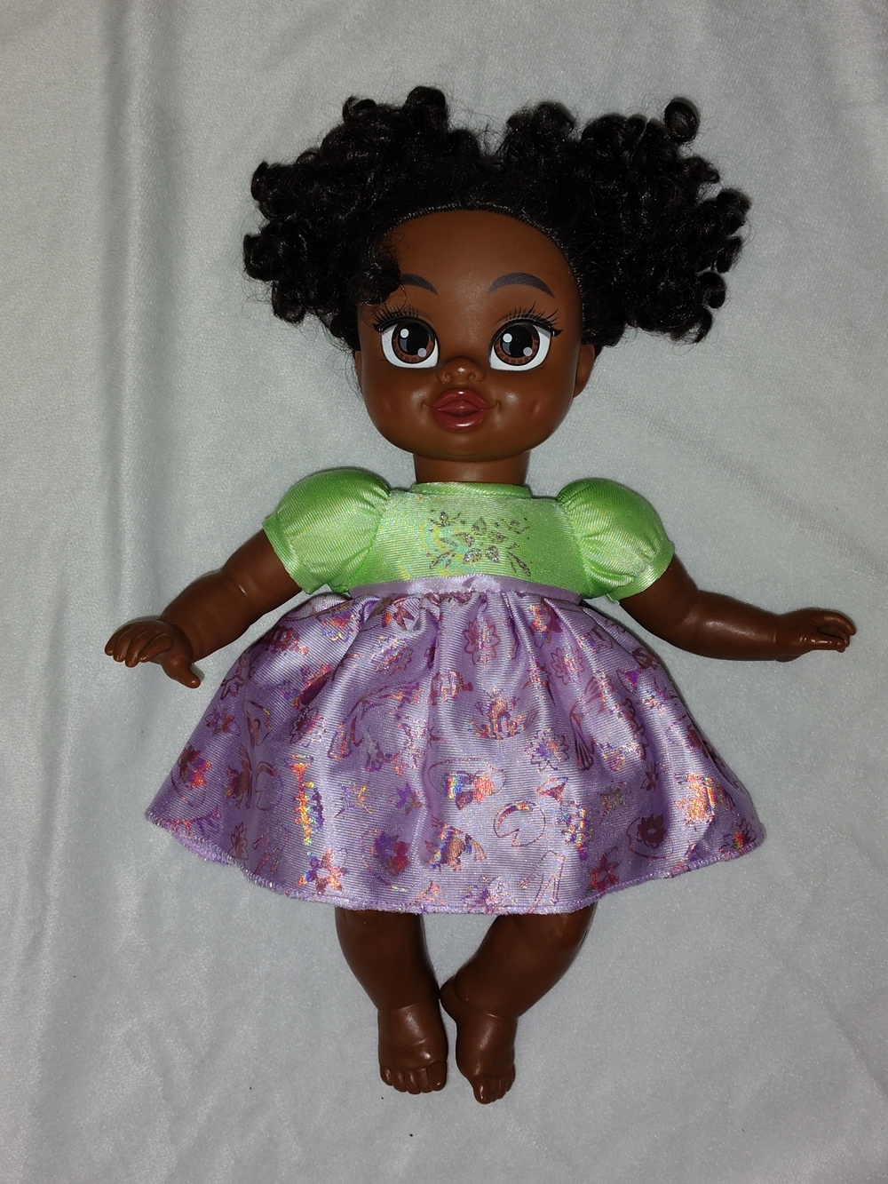 Disney Brown-Skinned Doll with Black Curly Hair, Purple Skirt & Bright Green Top